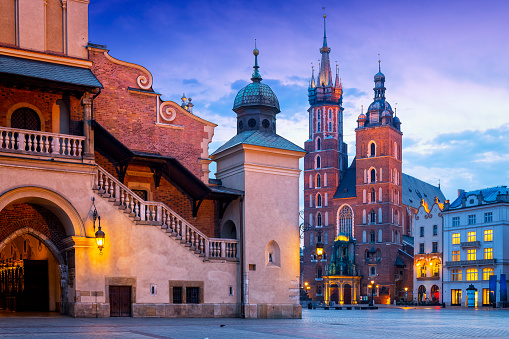 Morning view of renaissance Cloth Hall Sukiennice and Church Assumption of the Blessed Virgin Mary on the Main Market Square, Krakow, Poland