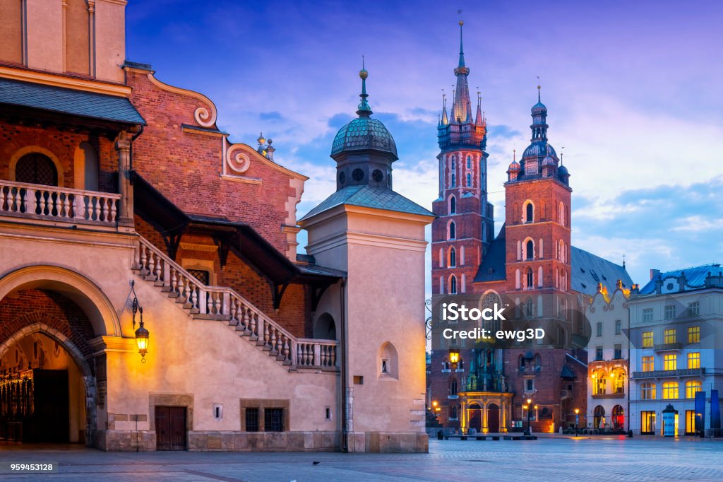 Renaissance Cloth Hall Sukiennice and Church Assumption of the Blessed Virgin Mary on the Main Market Square, Krakow, Poland Morning view of renaissance Cloth Hall Sukiennice and Church Assumption of the Blessed Virgin Mary on the Main Market Square, Krakow, Poland Krakow Stock Photo