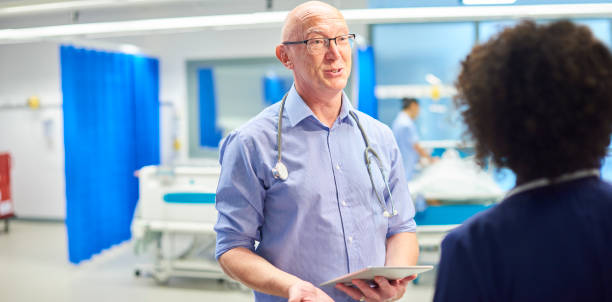 istock senior doctor with nurse 959453954