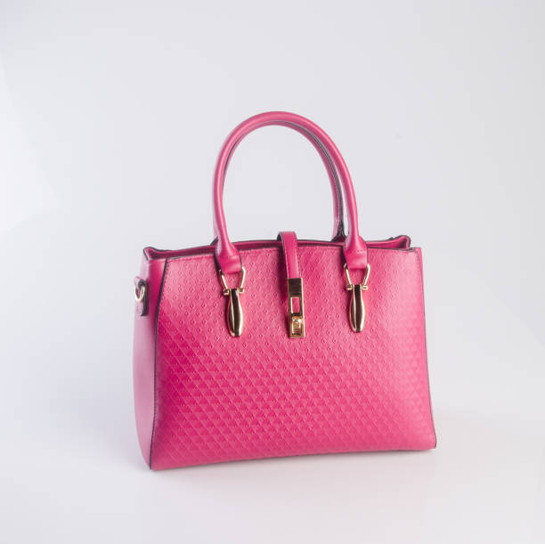 istock woman bag on a background 959454420