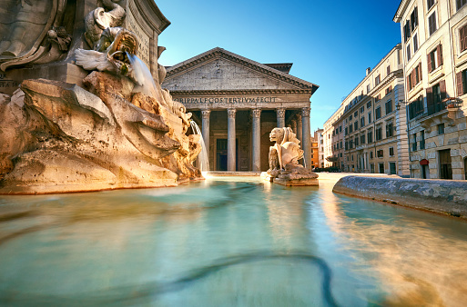 Fountain on Piazza della Rotonda with Parthenon behind on a bright morning in Rome, Italy