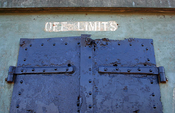 istock Serious Bolted Iron Door Prison Barracks 95945854
