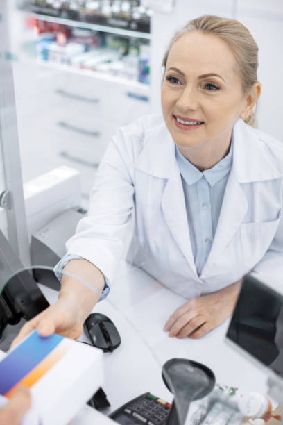 istock Appealing female pharmacist demanding prescription 959459366