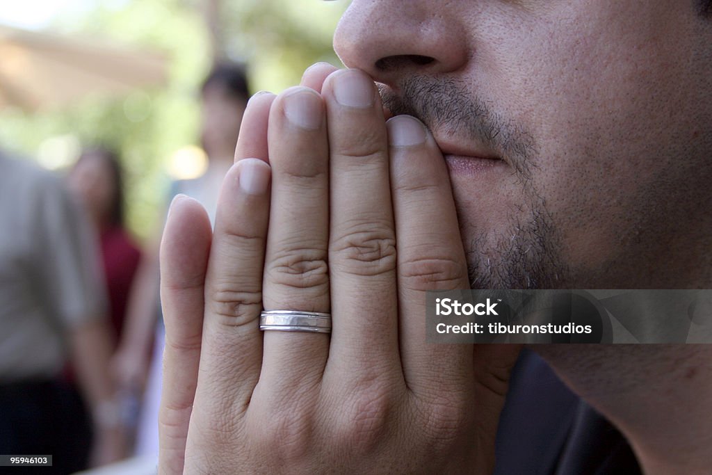 Faithful Married man thinking about loyalty, wedding ring forefront Adult Stock Photo