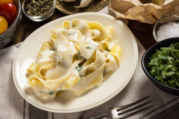 istock Pappardelle Pasta with Creamy Alfredo Sauce 959462074