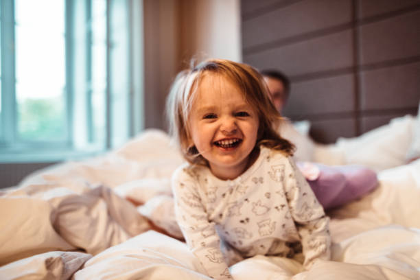 istock happy family in the bed 959462832