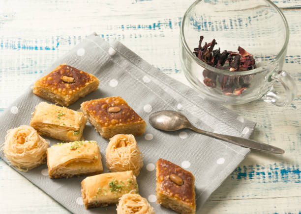 istock Oriental sweets on a wooden background. 959463928