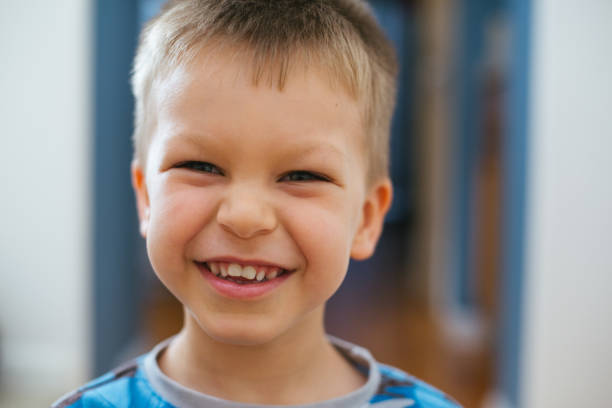 istock Four year old boy cheesy smile portrait 959464902
