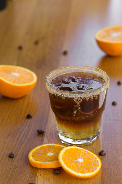 istock Cold coffee with brown sugar, orange and ice cubes 959465040