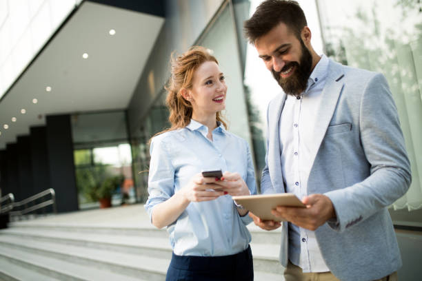 istock Business people walking and talking outdoor 959467282