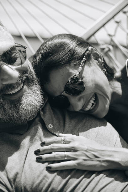 istock Couple resting together in a hammock 959467486