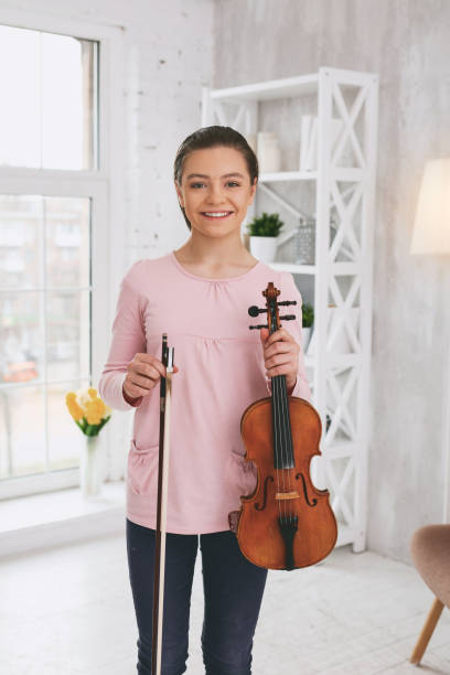 istock Pleased violinist looking straight at camera 959467970