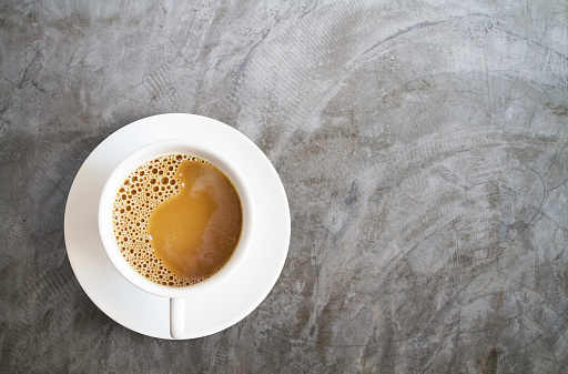white coffee cup isolated on cement background
