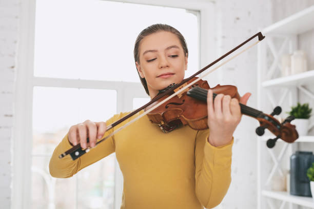 istock Attentive musician learning melody at home 959469050