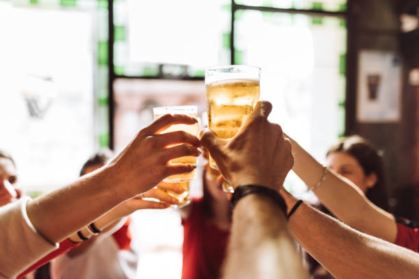 istock group of friends toasting the beer in a pub 959482962