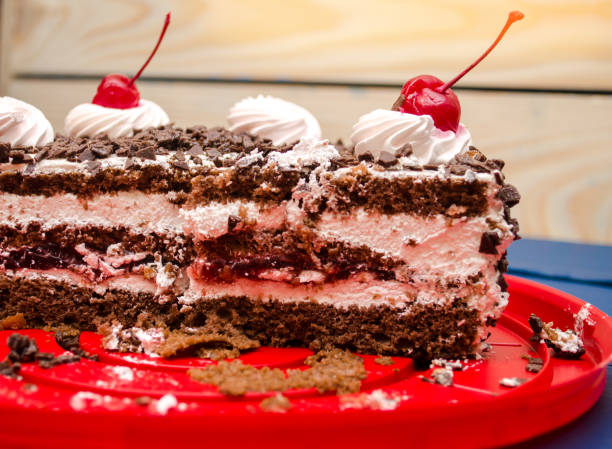 istock cherry cake on the table, sweet, bright background, blue wooden background 959487616