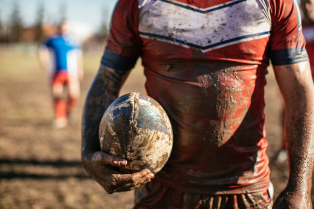 istock Rugby player standing on a playing field with ball 959488530