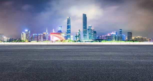 istock empty asphalt highway and modern city skyline in Guangzhou at night 959489384