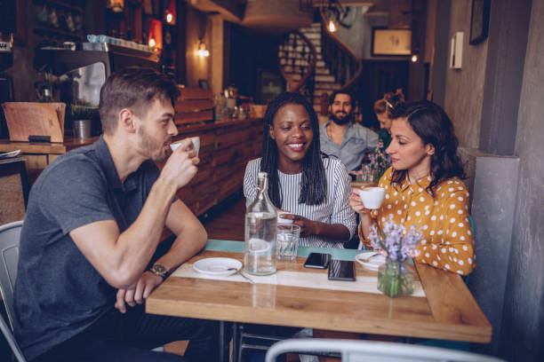 istock Young friends at coffee shop 959491668