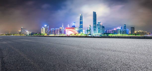 istock empty asphalt highway and modern city skyline in Guangzhou at night 959491858
