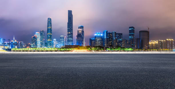 istock empty asphalt highway and modern city skyline in Guangzhou at night 959492842