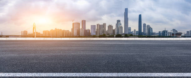 istock empty asphalt road and modern city skyline in Guangzhou at sunset 959493156