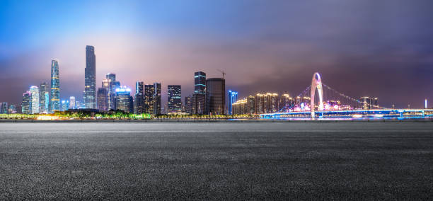 istock empty asphalt road and modern city skyline in Guangzhou at night 959493468