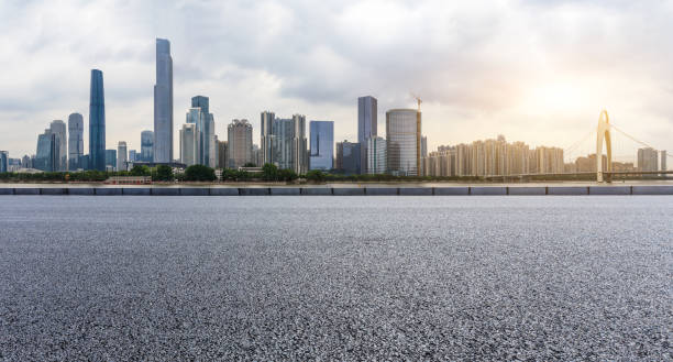 istock empty asphalt road and modern city skyline in Guangzhou at sunset 959493942