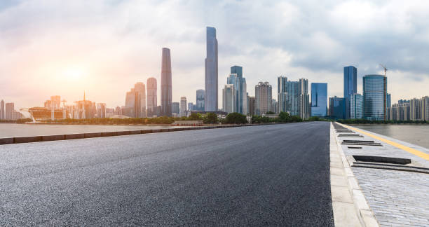 istock empty asphalt road and modern city skyline in Guangzhou at sunset 959493944