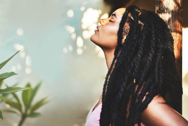 Her beauty glows from within, shining out Cropped shot of a beautiful young woman posing in nature dreadlocks stock pictures, royalty-free photos & images