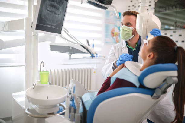 istock Dentist and patient looking at x-ray dental footage 959495568