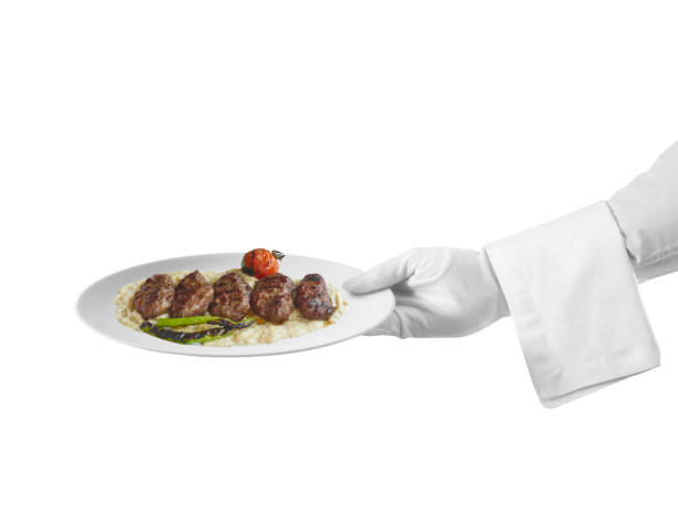 istock Waiter serving a meatball dish 959495968