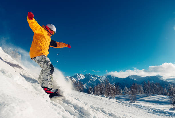 istock snowboarder is sliding with snowboard 959498364