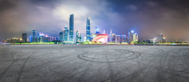istock empty asphalt square road and modern city skyline in Guangzhou at night 959499264