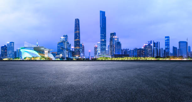 istock empty asphalt square road and modern city skyline in Guangzhou at night 959501968