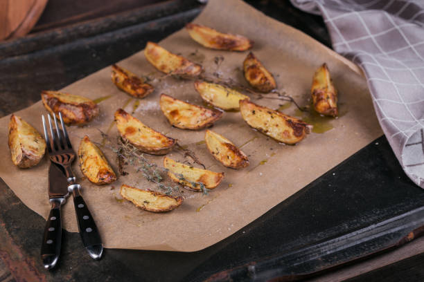 istock Delicious baked potatoes with herbs and salt 959503712