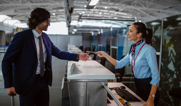 istock Young businessman doing check-in at airline desk 959508878
