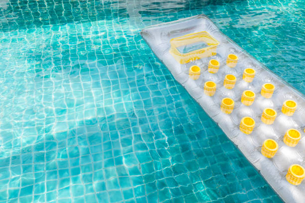 istock Design air mattress floating on clear swimming pool water 959512232