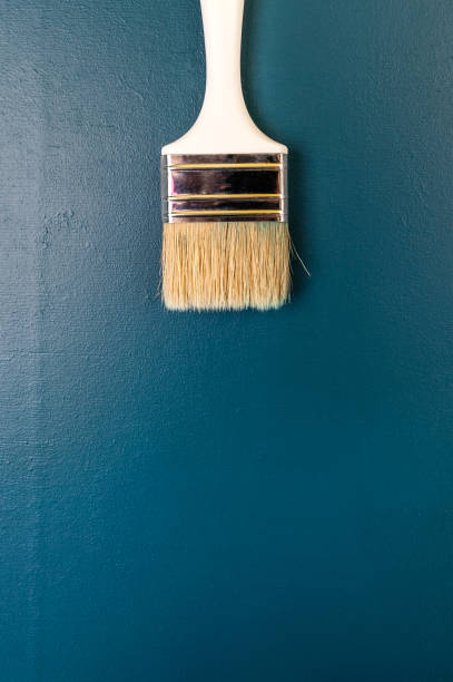istock Paint brush on a dark blue background. Free space for text. 959513116