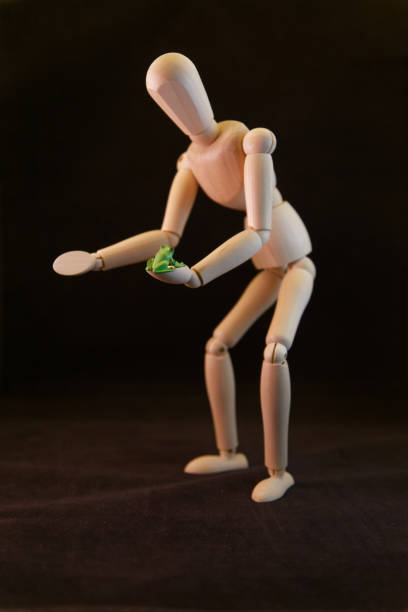 istock artist mannequin with a frog 959518378