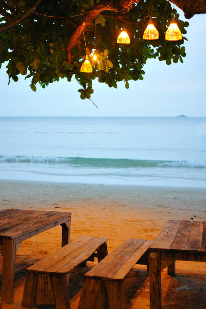 istock Sunset time with chair on beach. 959518502