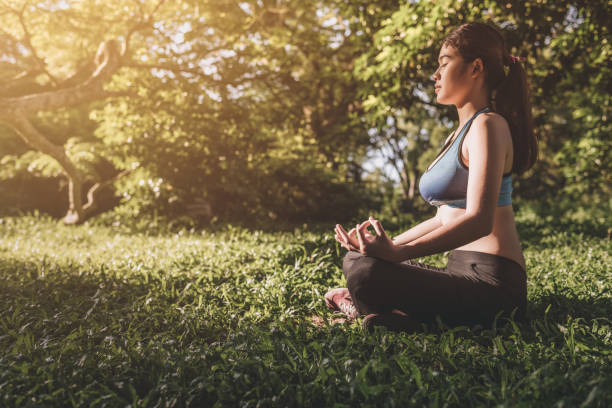 istock Yoga in the park, outdoor with effect light, 959522880