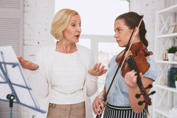 istock Angry girl looking at her tutor 959525850