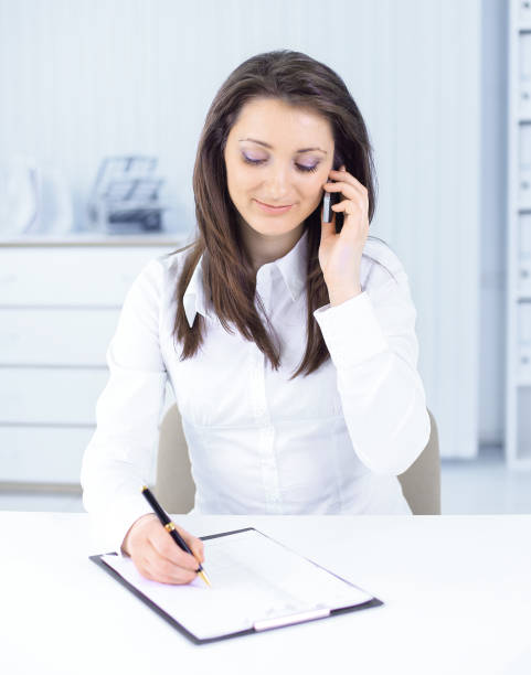 istock business woman discussing work documents on a mobile phone 959527242
