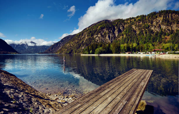 istock Lake in the background of mountains. 959527356