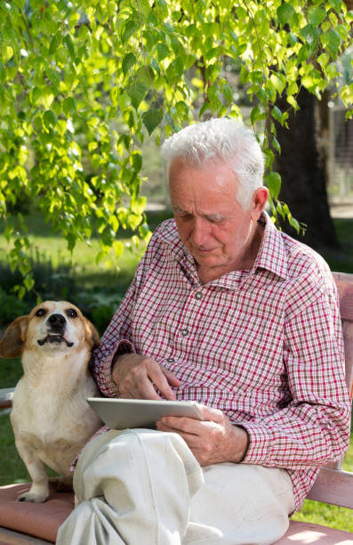 istock Senior man with tablet crying in park 959527586