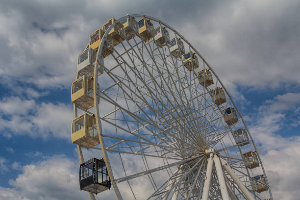 istock Ferris wheel on background cloudy sky. Festival 959528758