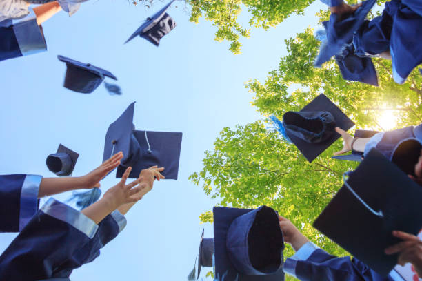 Graduation Throwing graduation hats junior high photos stock pictures, royalty-free photos & images
