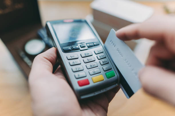 istock Customer paying with credit card swipe 959532924