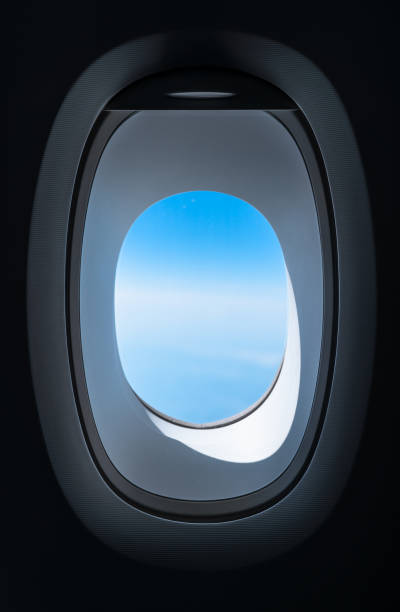 istock Airplane Window and Blue Sky in Flight 959535838
